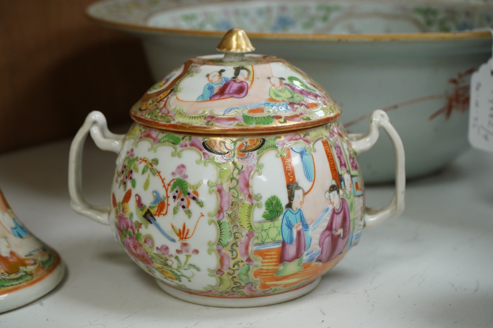 A collection of 19th century Chinese porcelain to include a pair of famille rose candlesticks, dish and a pair of blue and white baluster vases and covers
